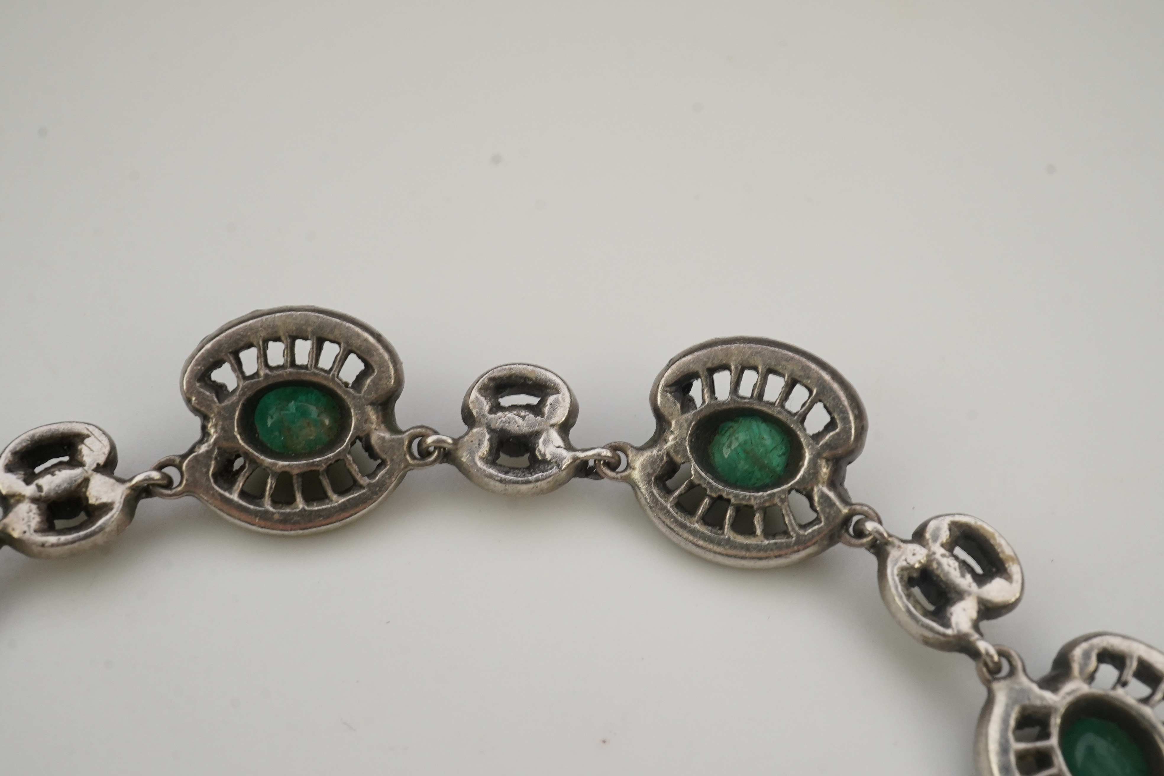 An emerald and rock crystal demi-parure, France, early 20th century